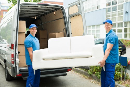 Commercial office removals in Egham showing packed furniture and organized moving process