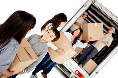 Family settling into a new home after moving in Egham