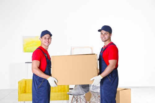 Removal team preparing household items for transport