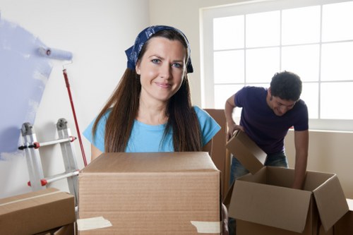 Student and household packing boxes organized for an Egham move