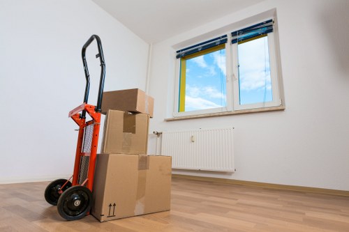 Removal van and moving boxes in Egham