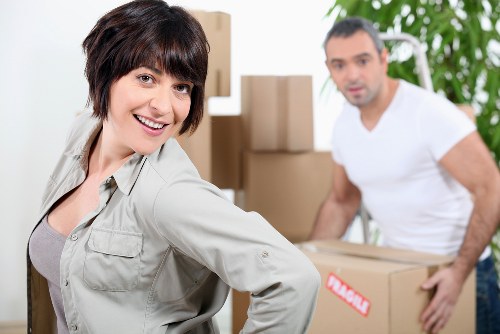 Packed boxes and furniture prepared for a removal van in Egham