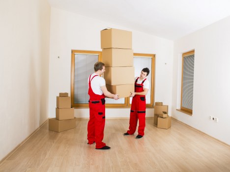 Removal team loading furniture for a move in Egham