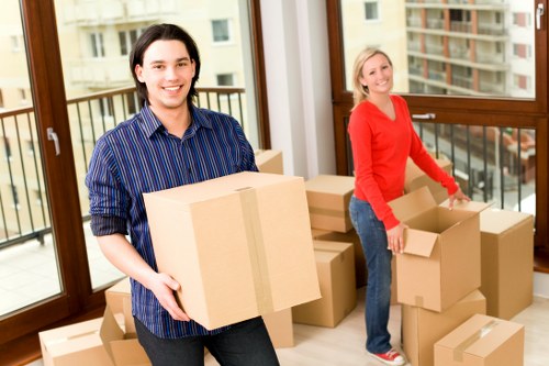Moving boxes and furniture arranged for house removals in Egham