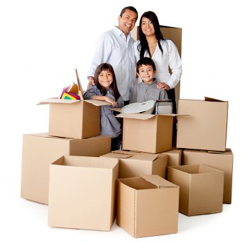 Packed moving boxes and wrapped furniture ready for relocation